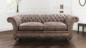 photo of brown chesterfield sofa